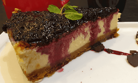 Baked Cheeseslice (1 slice) - Warm Blue Berry Sauce